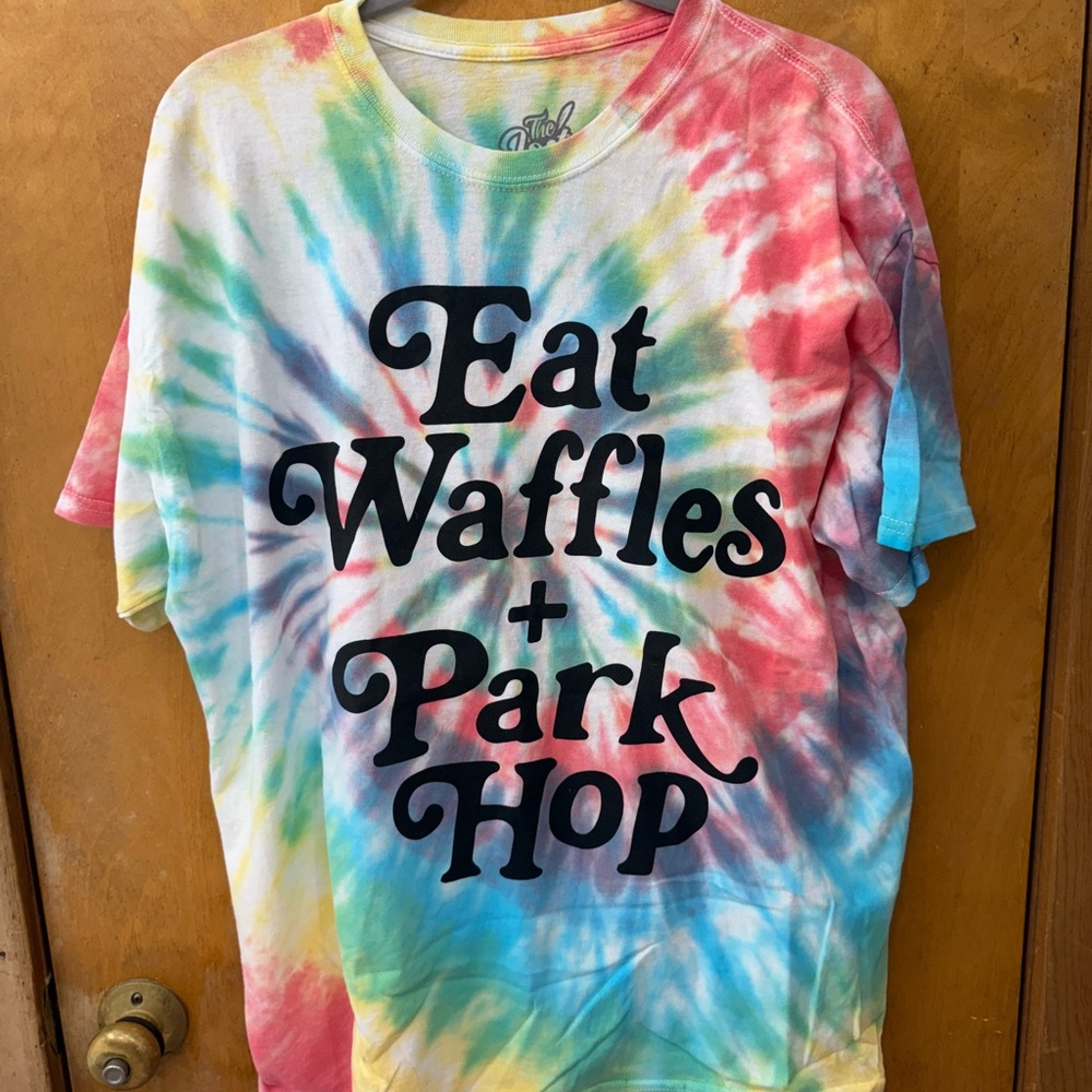 Tie Dye Short Sleeve Shirt with Eat Wasfles and Park Hop saying
